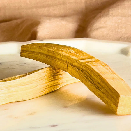 Wooden block on a marble surface with a blurred background