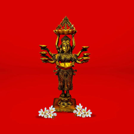 Bronze statue of a deity with multiple arms on a red background